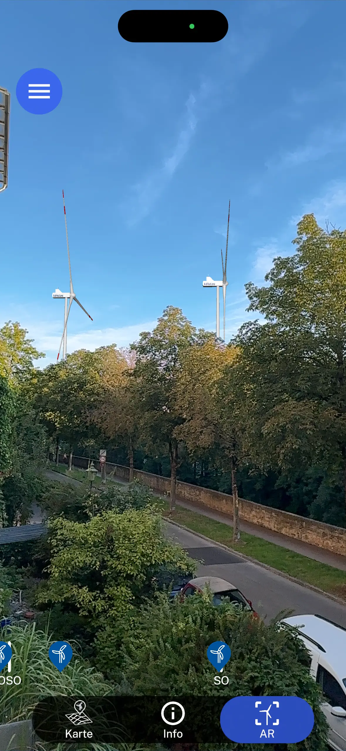 AR-Ansicht: geplante Windturbinen stehen maßstabsgetreu in der realen Umgebung